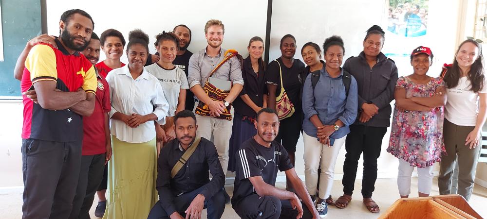 Alexandre Lafargue, Official Representative of New Caledonia to Papua New Guinea, with students learning French and Indonesian